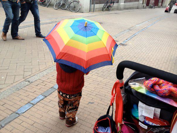 T with rainbow umbrella